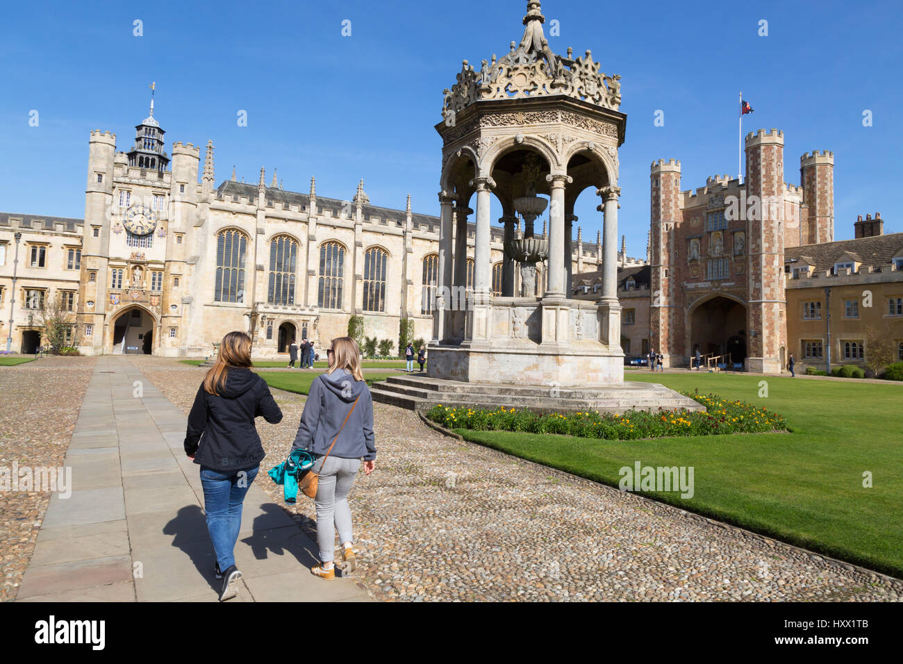 Trinity College Cambridge University - people walking in Great Court, Cambridge England, Cambridge UK Stock Photo