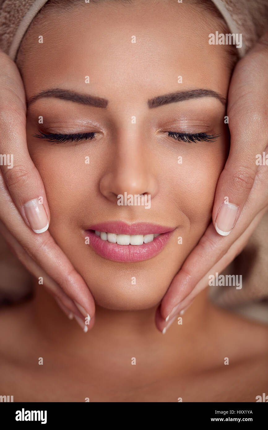 woman receiving professional face massage in spa salon Stock Photo Alamy