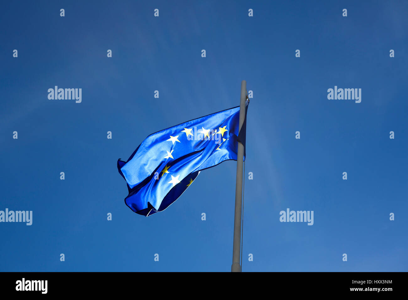Flag of European Union on a flagpole in front of blue sky Stock Photo ...
