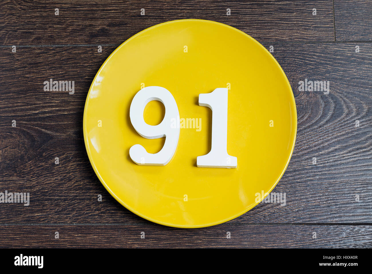 The number ninety one on the yellow plate and brown background Stock ...