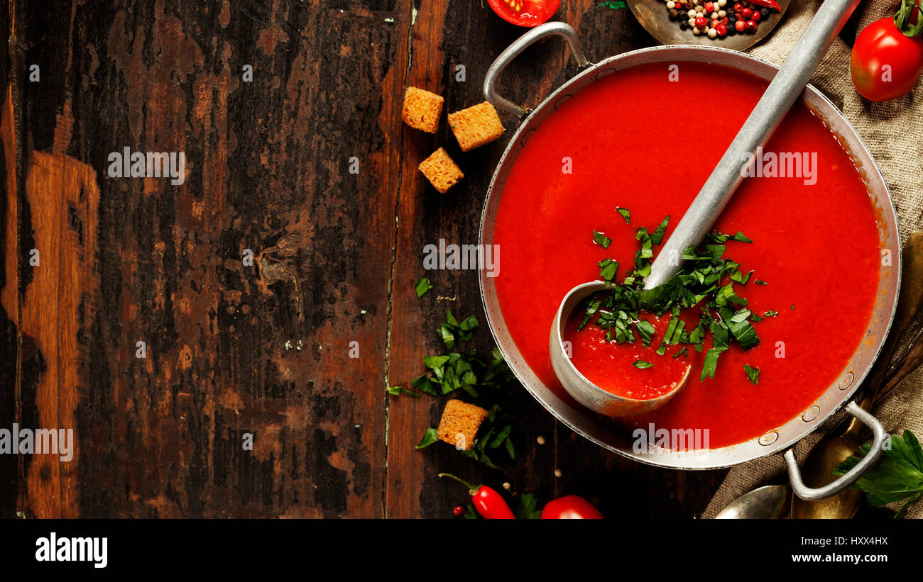 Homemade Tomato soup on wooden table, top view Stock Photo - Alamy