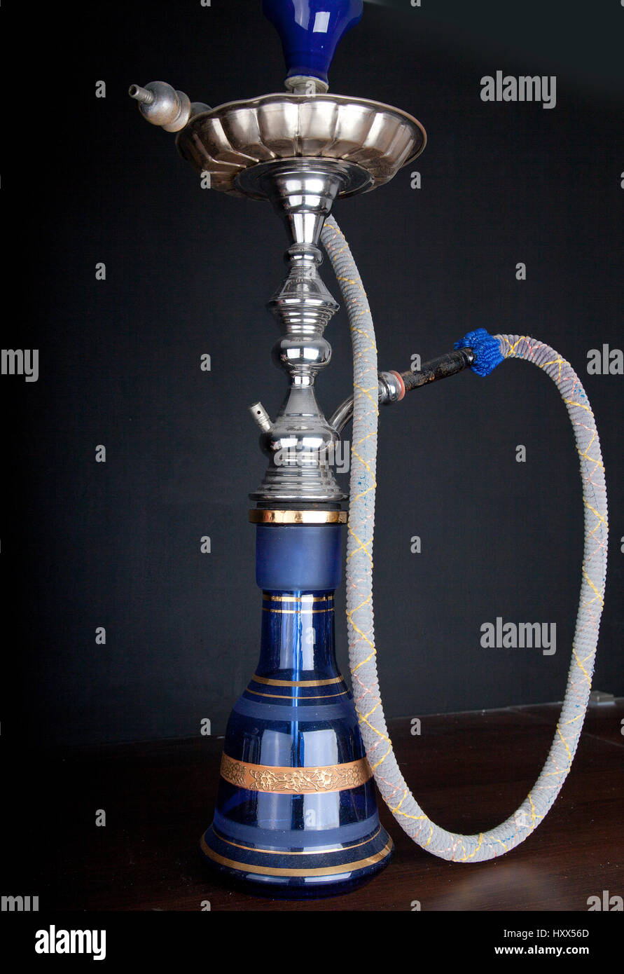 Oriental water pipe on dark black background Stock Photo Alamy