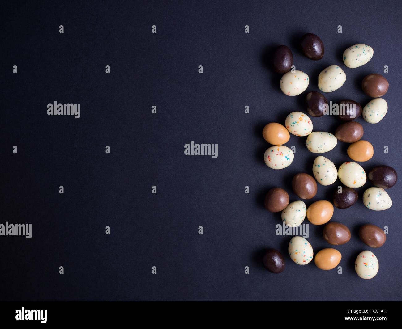 Chocolate easter eggs isolated on black background Stock Photo - Alamy