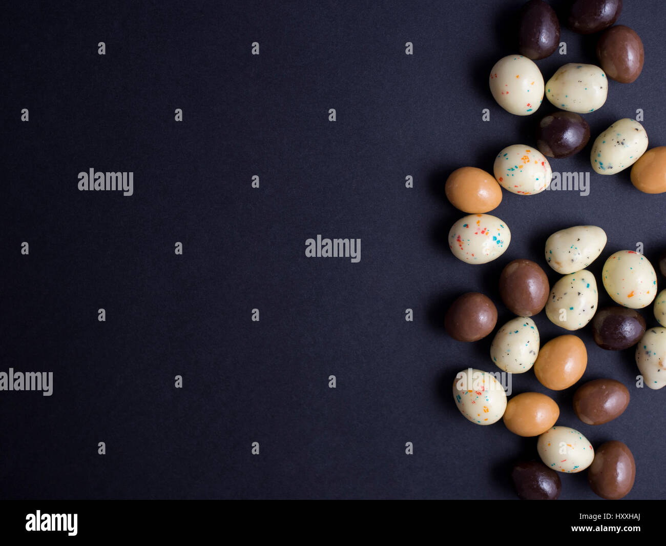 Chocolate easter eggs isolated on black background Stock Photo - Alamy