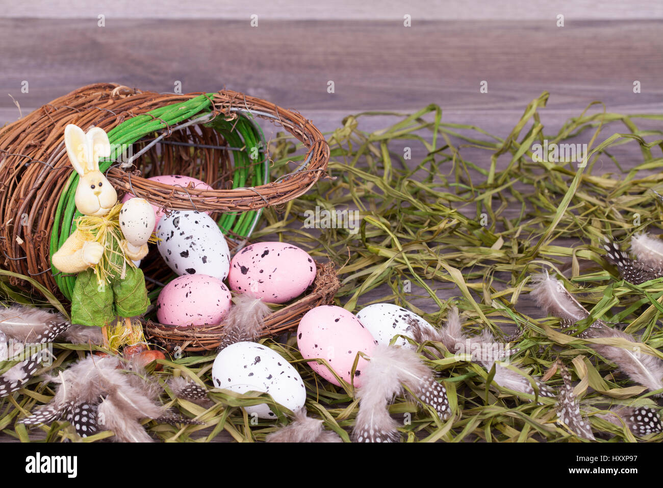 Easter decoration with eggs on a wooden background Stock Photo - Alamy