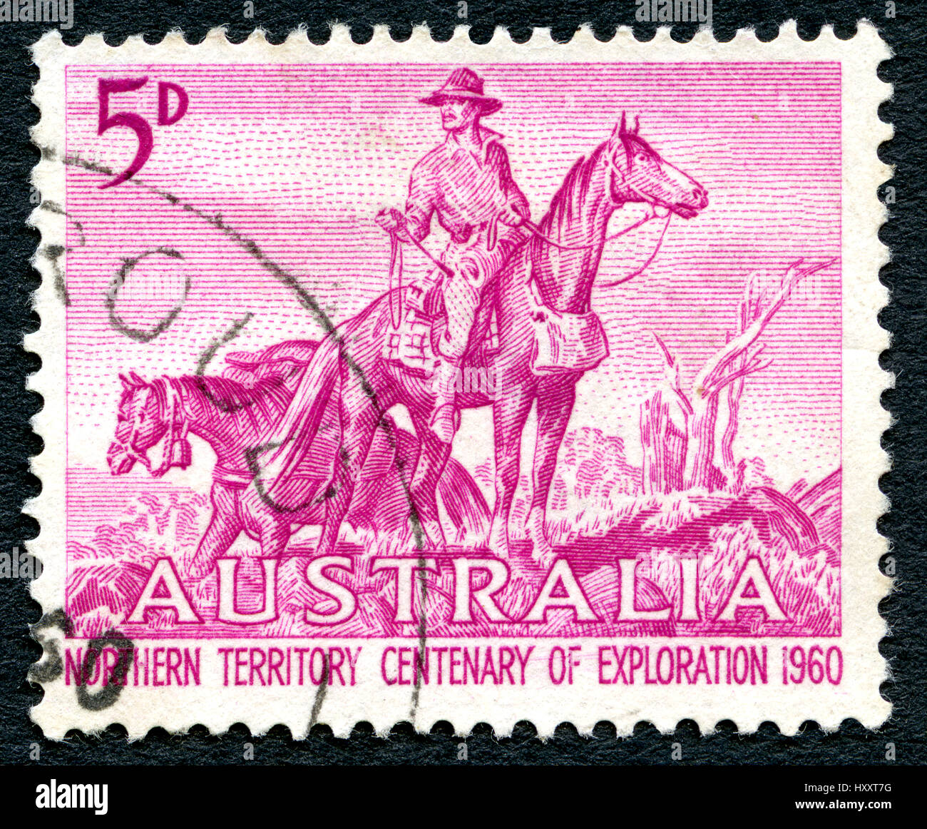 AUSTRALIA - CIRCA 1960: A used postage stamp from Australia, depicting an illustration of an Overlander and celebrating 100 years of Northern Territor Stock Photo