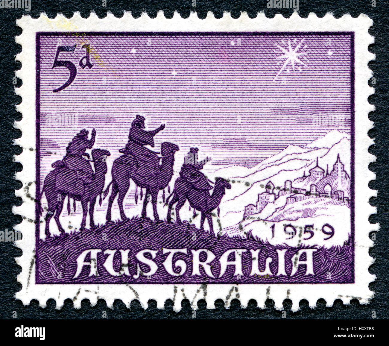 AUSTRALIA - CIRCA 1959: A used postage stamp from Australia, depicting a festive nativity illustration of the three wise men following the Star of Bet Stock Photo