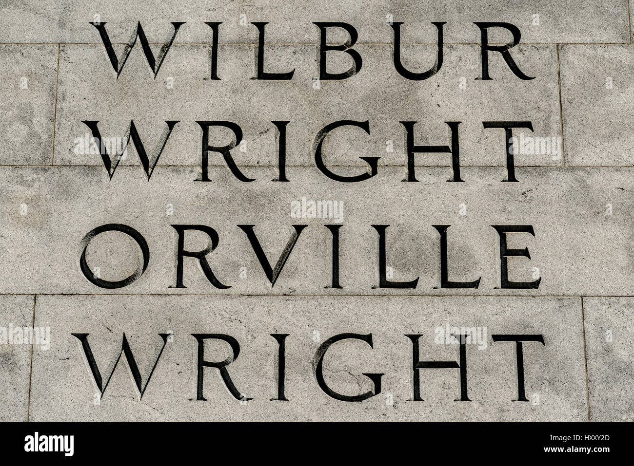 The Wright Brothers National Memorial in Kill Devil Hills, NC draws tourists from all around. It is an obelisk on a hill with a large grass field. Stock Photo