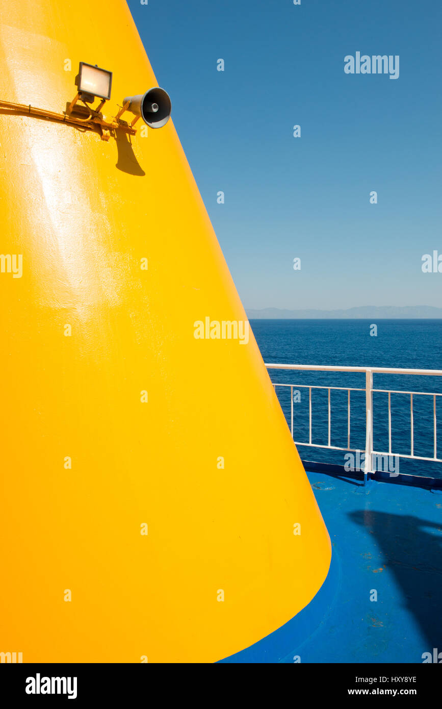 detail of yellow painted funnel with blue deck and white railings on Greek ferry, Greece, Europe Stock Photo