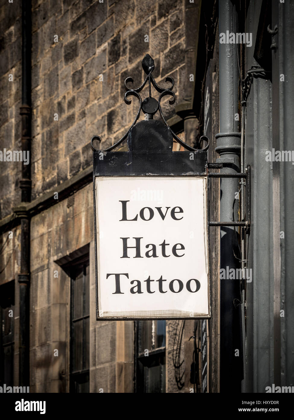 Love Hate Tattoo sign outside tattoo artist shop, Edinburgh, Scotland. Stock Photo