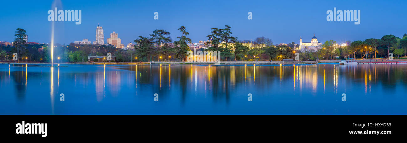 The Casa de Campo park in Madrid, Spain, is the biggest green area in the city. From the lake margins one has a beautiful of the Cathedral and Plaza E Stock Photo