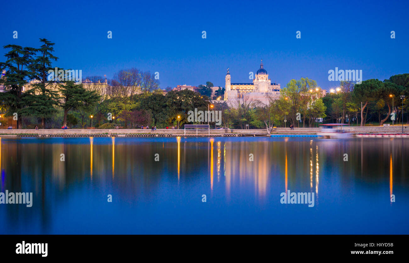 The Casa de Campo park in Madrid, Spain, is the biggest green area in the city. From the lake margins one has a beautiful of the Cathedral. Stock Photo