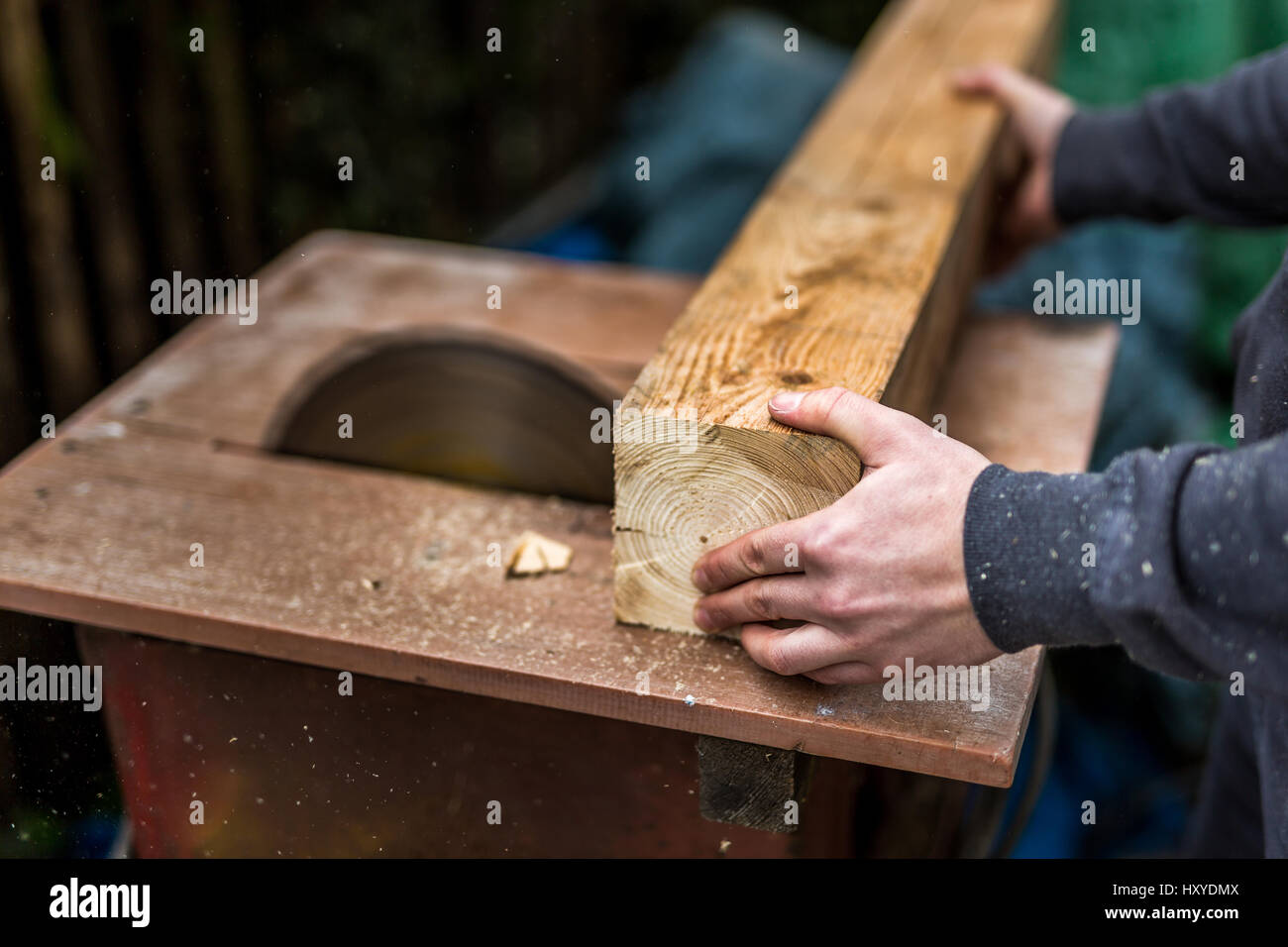 man cutting wood on a circular saw Stock Photo - Alamy