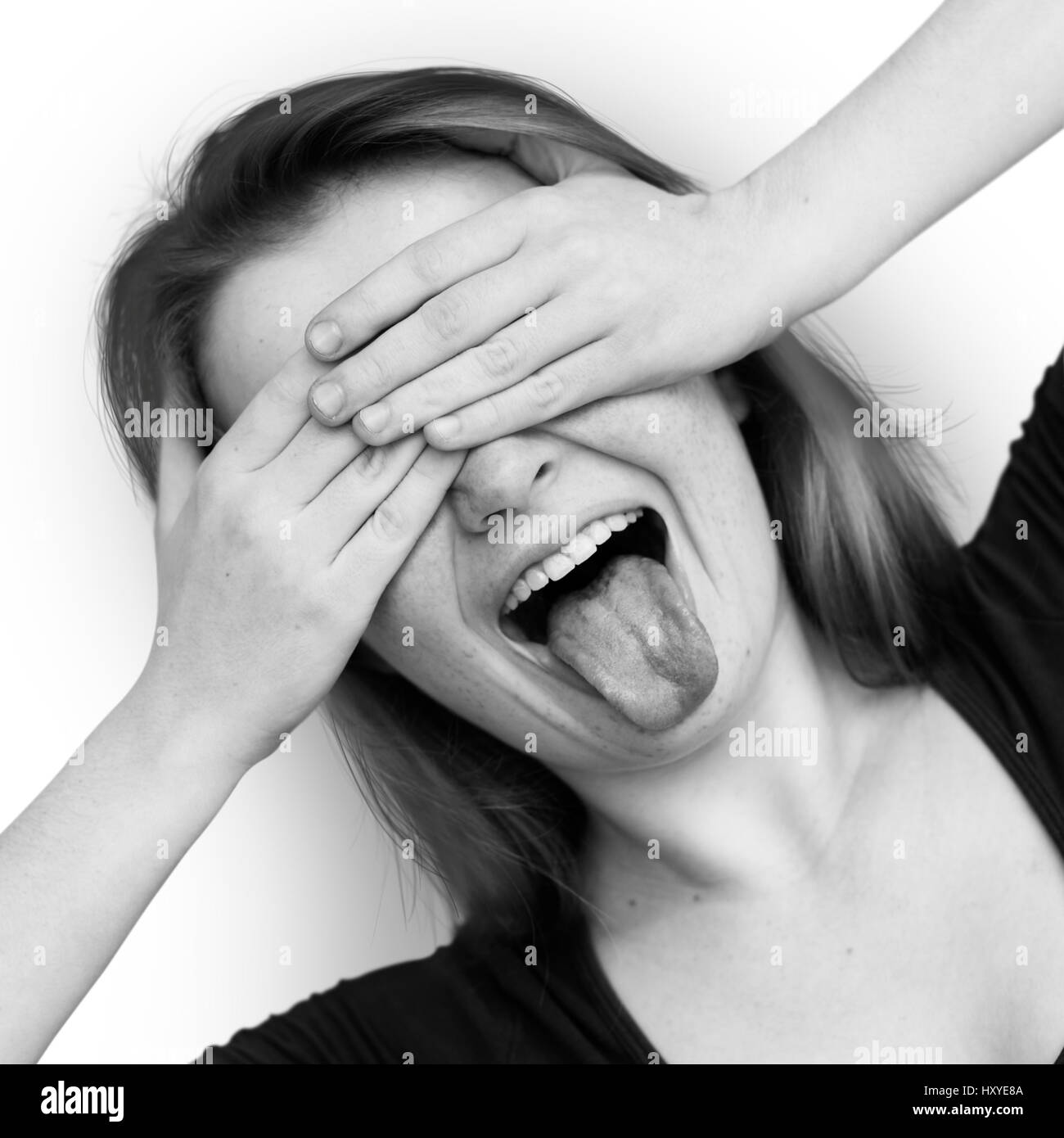 Young Cheerful Poking Tongue Portrait Stock Photo