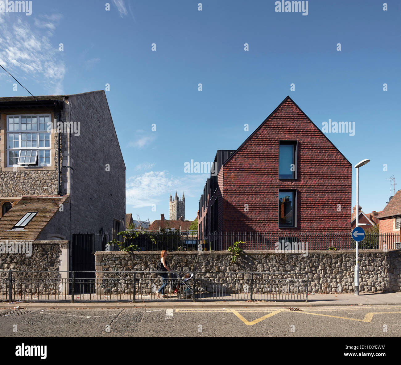 Perimeter wall with boarding and Canterbury Cathedral