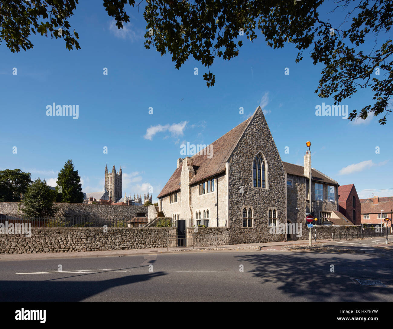 Street view along perimeter wall with old and new buildings and