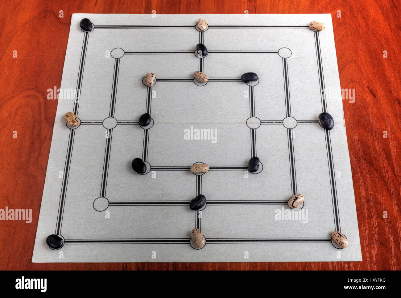 Traditional board for playing Nine Men’s Morris game Stock Photo - Alamy
