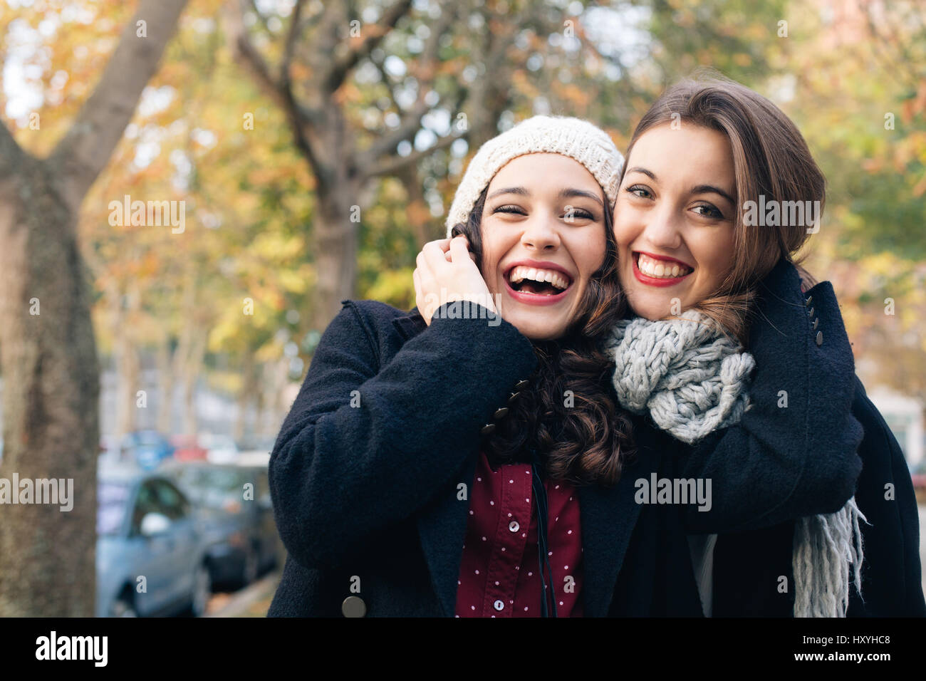 Best friends hugging outdoors hi-res stock photography and images ...