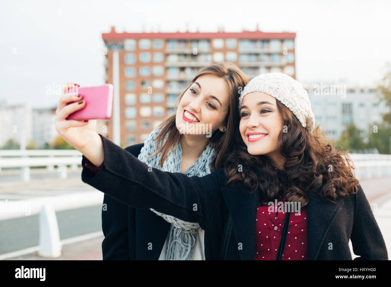 Friends taking selfie with smartphone stock photo