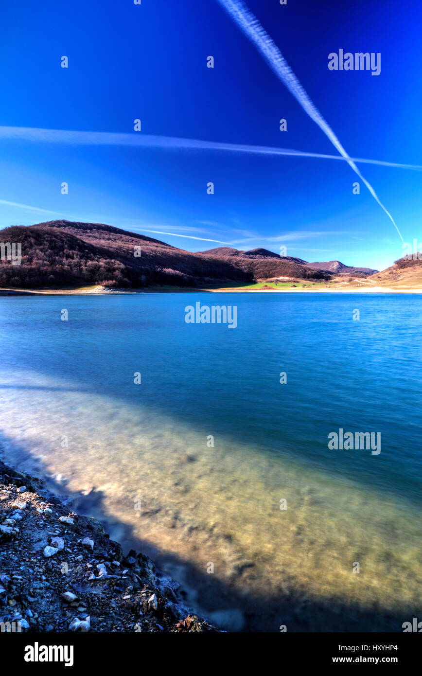 Beautiful landscape with pond and blue sky Stock Photo - Alamy