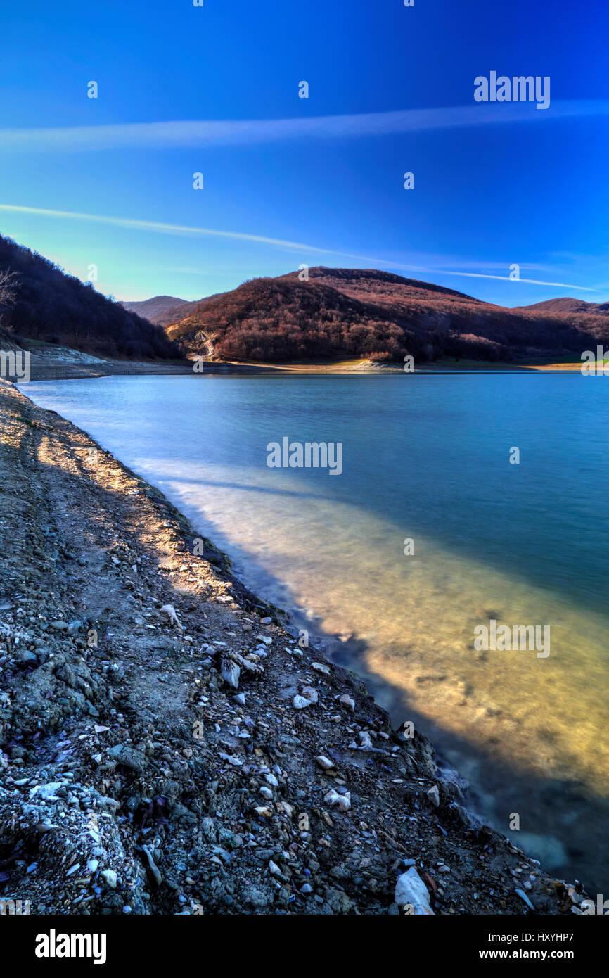 Beautiful landscape with pond and blue sky Stock Photo - Alamy