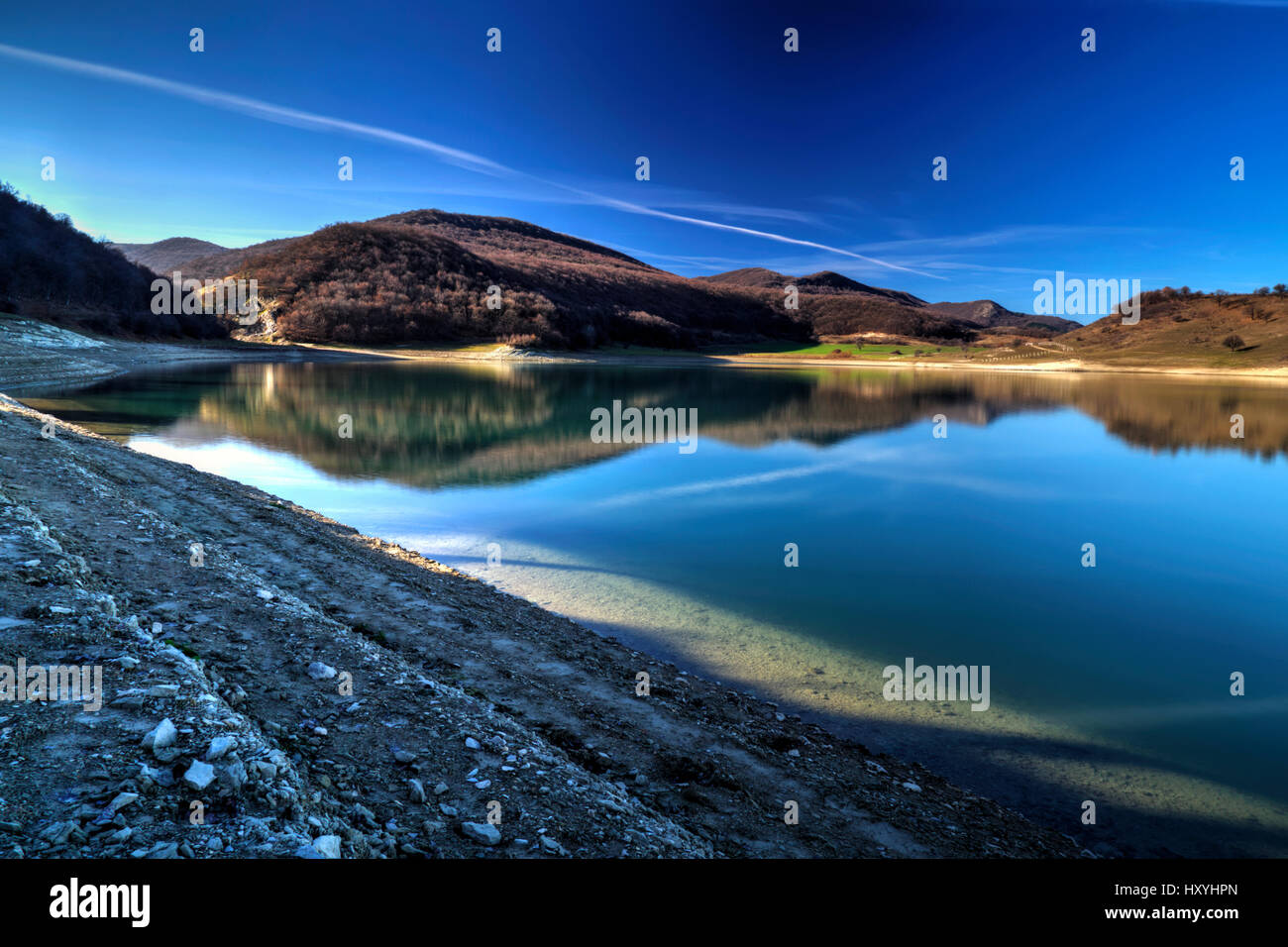 Beautiful landscape with pond and blue sky Stock Photo - Alamy