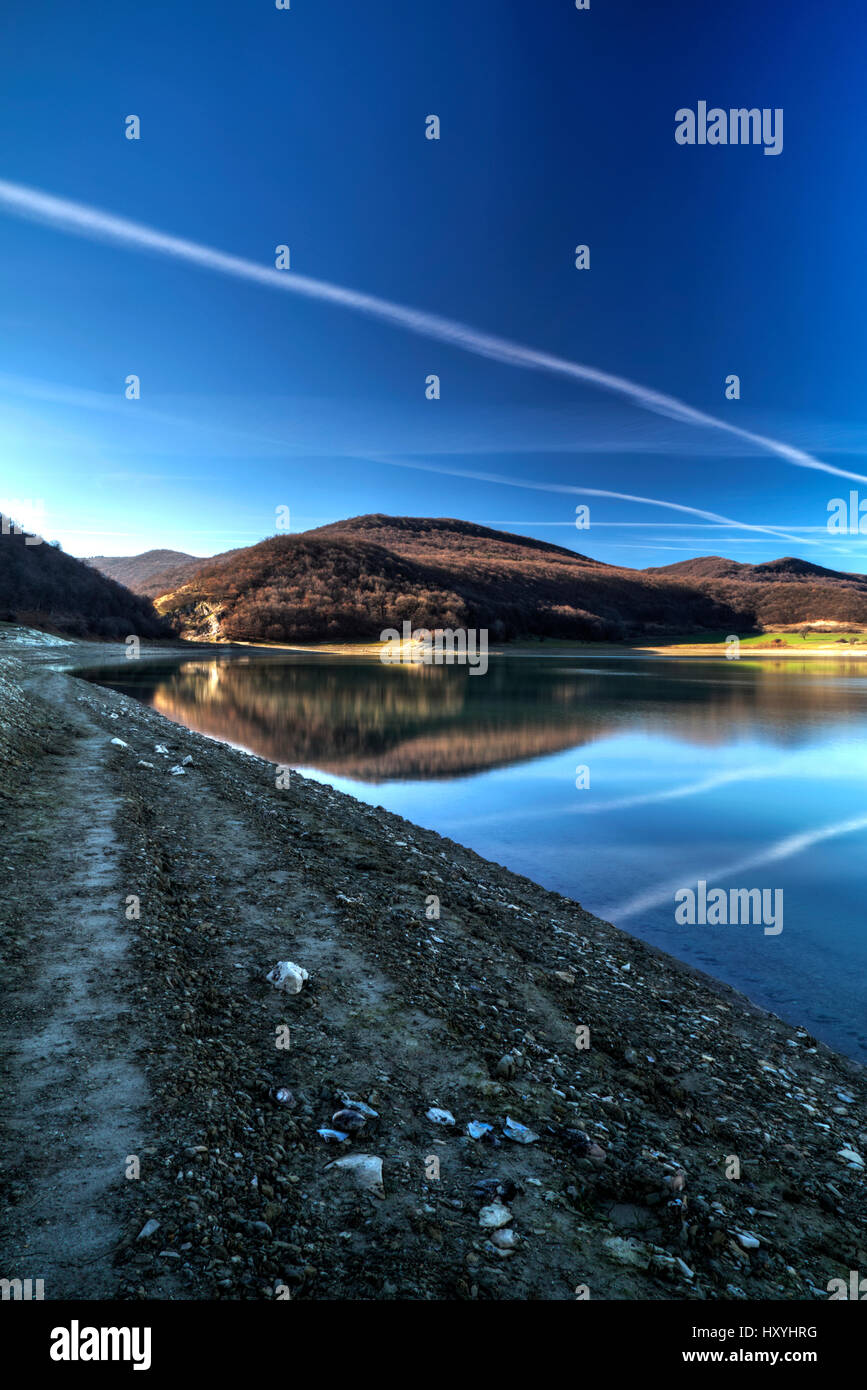 Beautiful landscape with pond and blue sky Stock Photo - Alamy