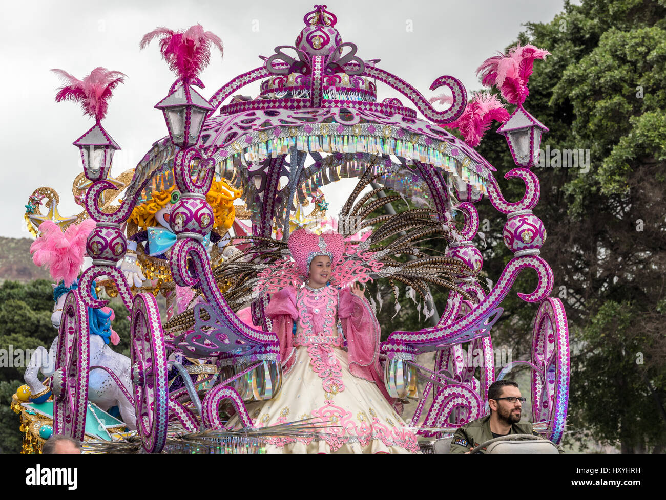 Child in elaborate costume on enormous decorated float in Tenerife
