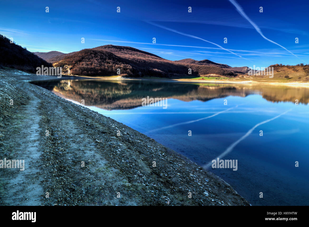Beautiful landscape with pond and blue sky Stock Photo - Alamy