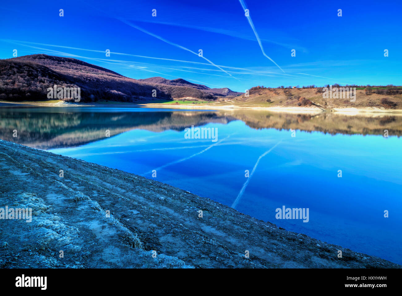 Beautiful landscape with pond and blue sky Stock Photo - Alamy