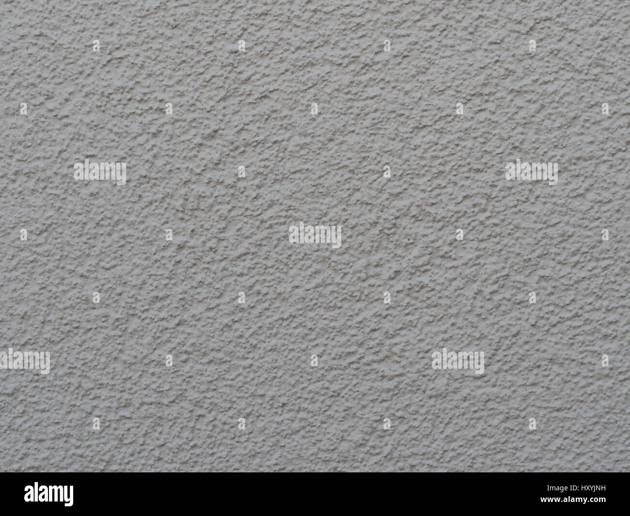 white painted wall with structural plaster closeup / macro in the