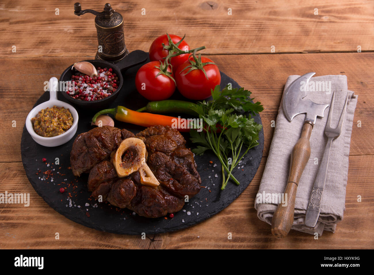 raw fresh meat on the bone cut Osso Buco on board Stock Photo Alamy