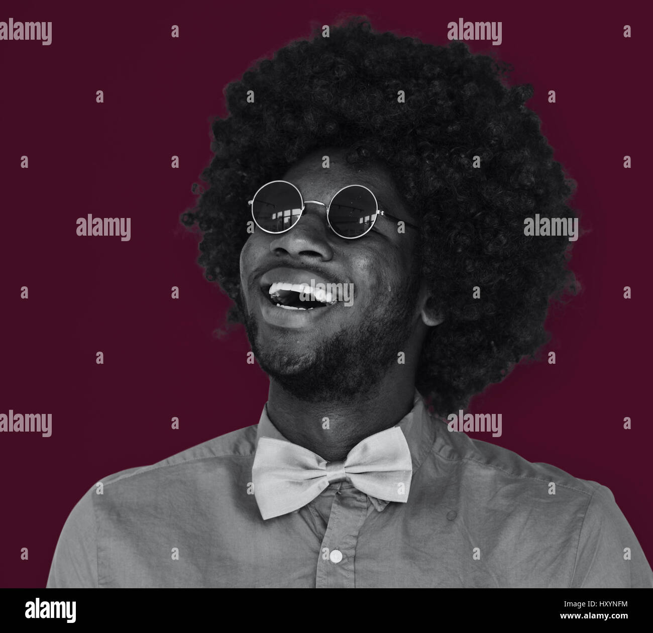A Guy with a Black Afro Wig Smiling Stock Photo Alamy