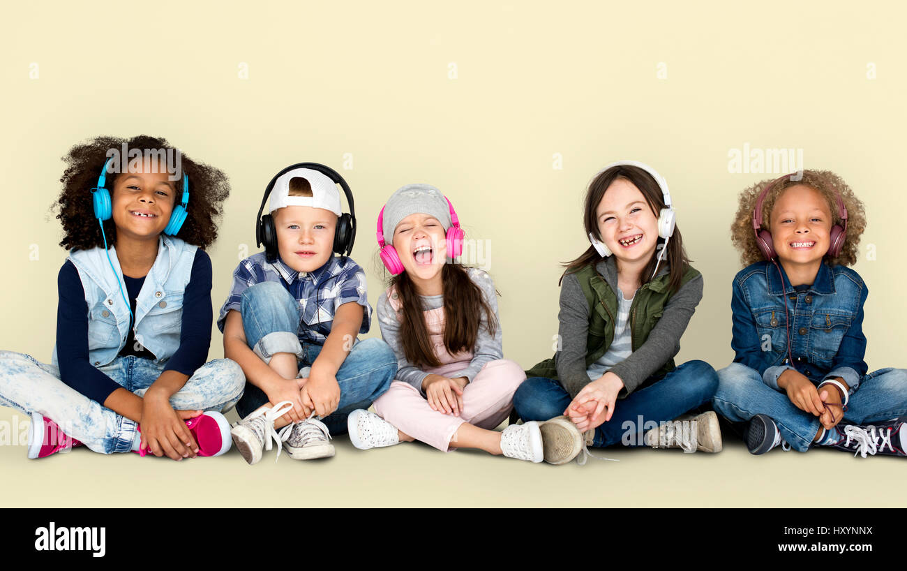 Group of Children Studio Smiling Wearing Headphones and Winter Clothes ...