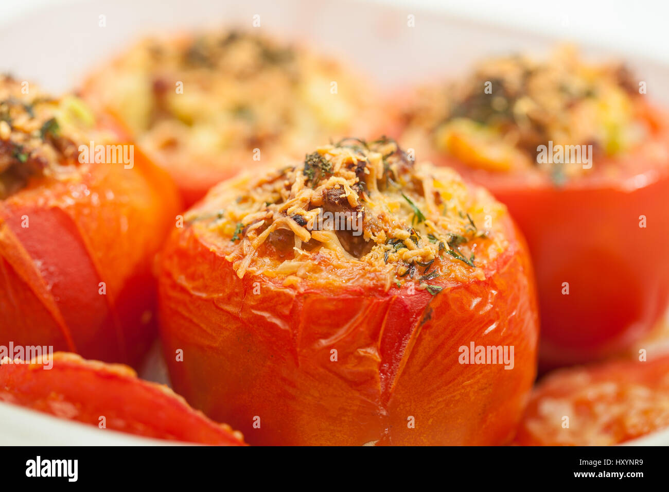 Stuffed tomatoes preparation : Just baked stuffed tomatoes Stock Photo