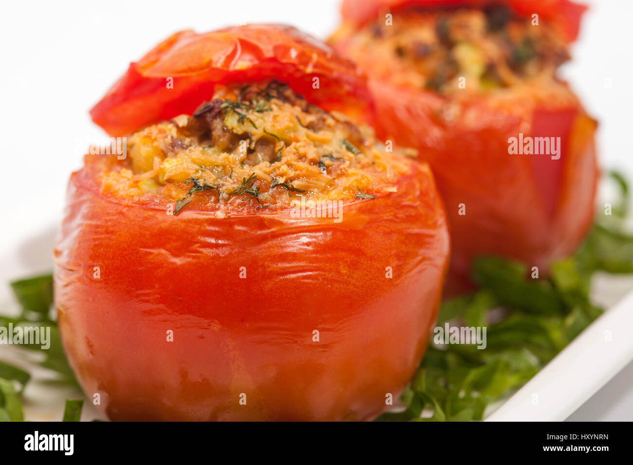 Stuffed tomatoes preparation : Just baked stuffed tomatoes Stock Photo