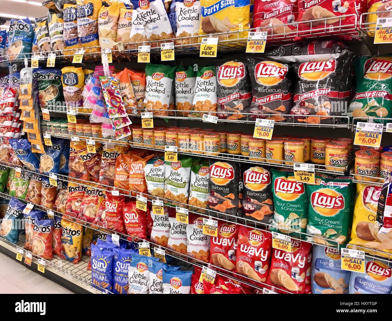 Snack chip selection at grocery store Stock Photo - Alamy