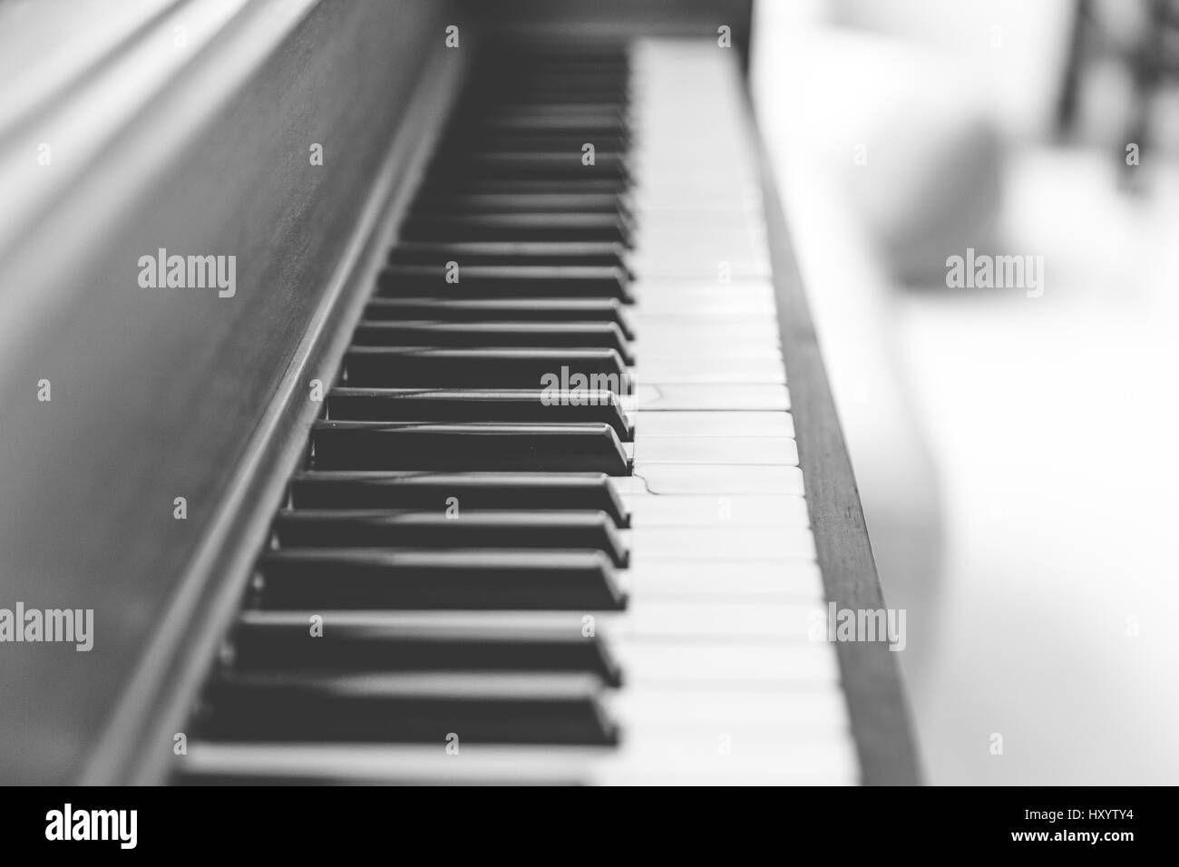 Black and white piano keys on a wooden upright piano Stock Photo Alamy
