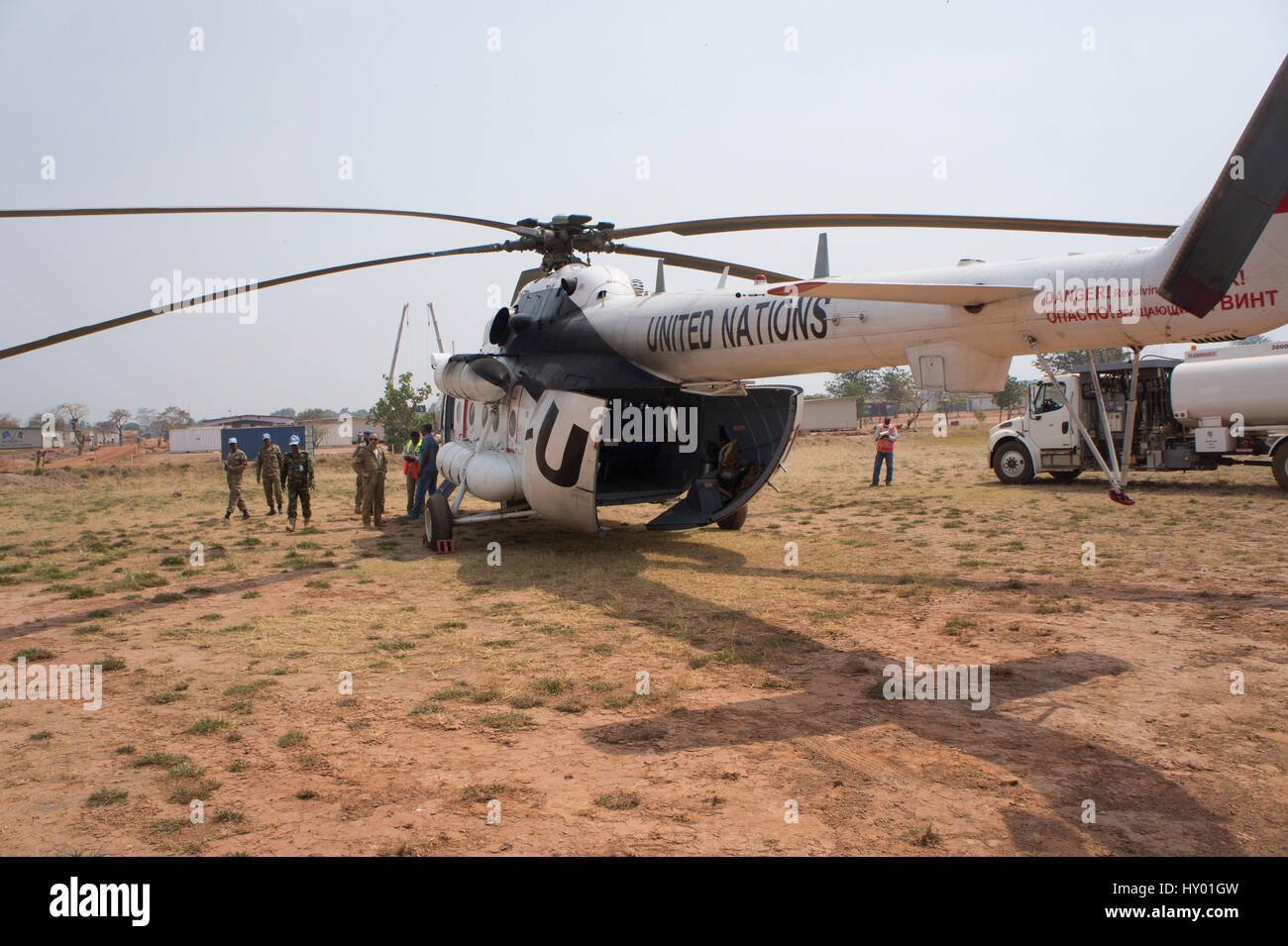A UN MI8 helicopter stands on a landing strip at a base in Kaga