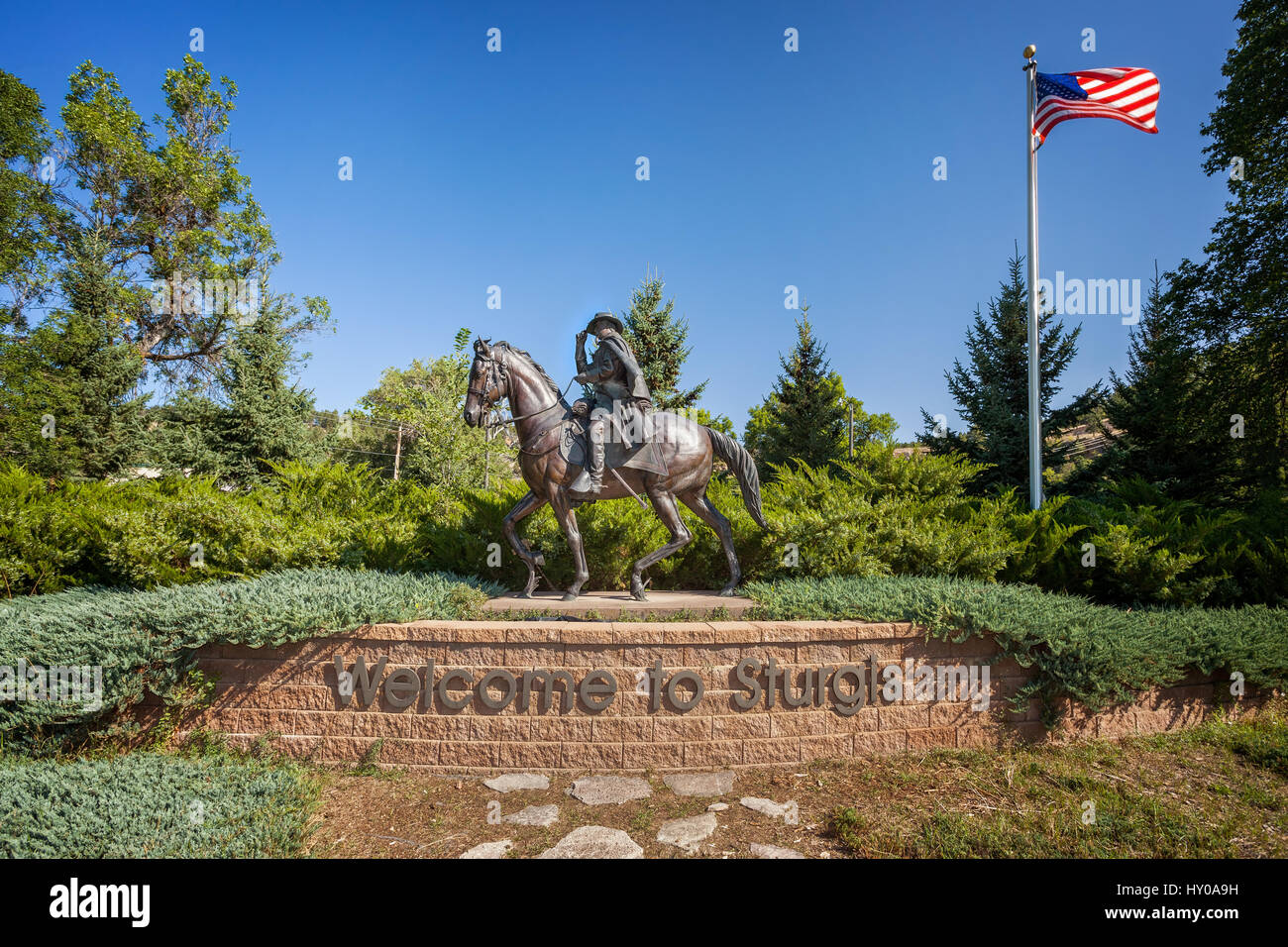Welcome to Sturgis Sign, Sturgis, South Dakota. A stock photo of the towns namesake, General Samuel D. Sturgis on  horseback, says welcome to Sturgis Stock Photo