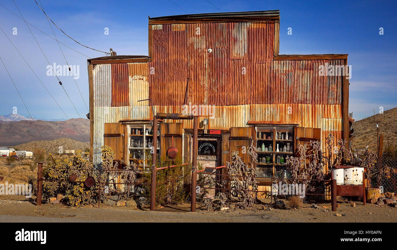 This rusted, tin sided building is currently home to an antique store in the living ghost town of Randsburg, California Stock Photo