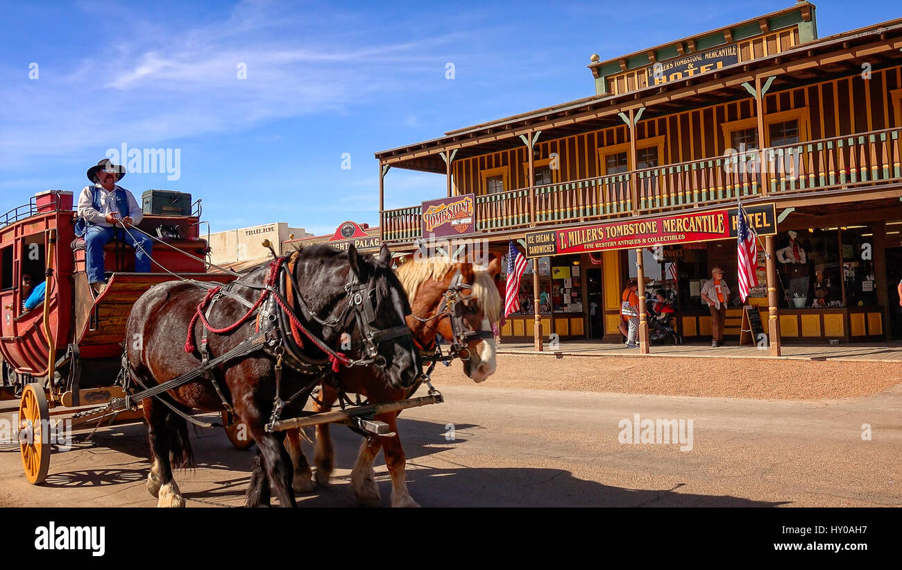 Stagecoach filled with tourists rolls down the streets of the wild west town of Tombstone, Arizona Stock Photo