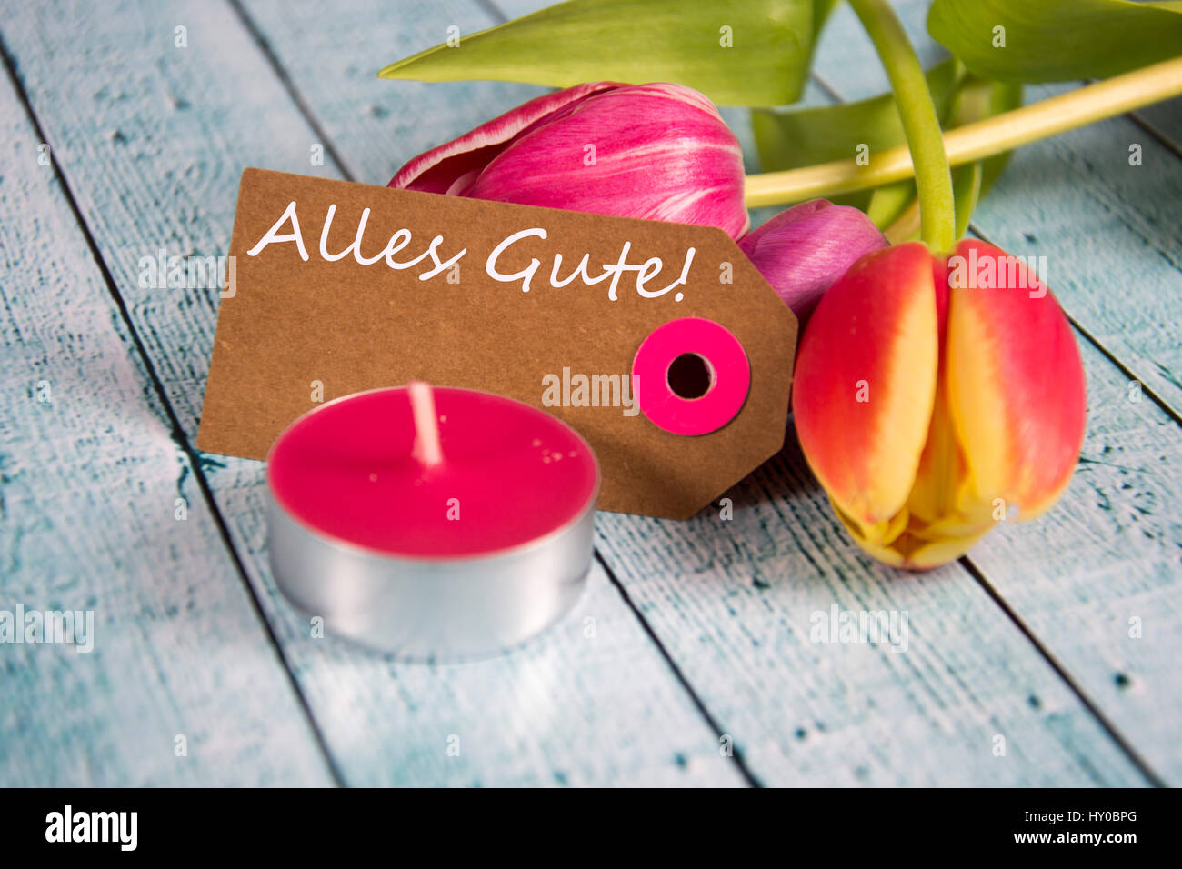Alles Gute ! inscription written on paper tag Stock Photo