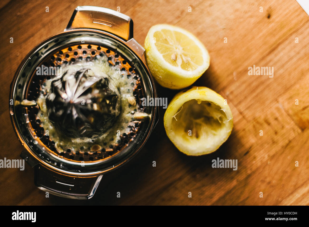 Lemons with Lemon Juicer Stock Photo Alamy