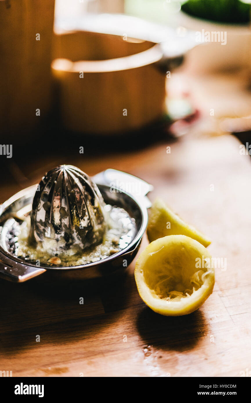 Lemons with Lemon Juicer Stock Photo Alamy