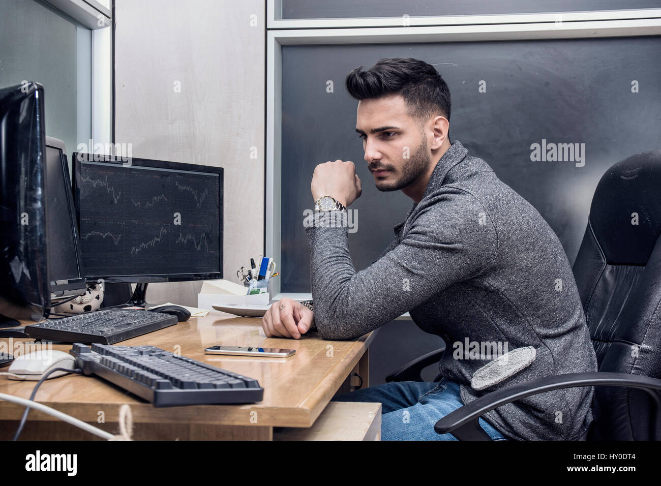 Handsome office worker using computer Stock Photo