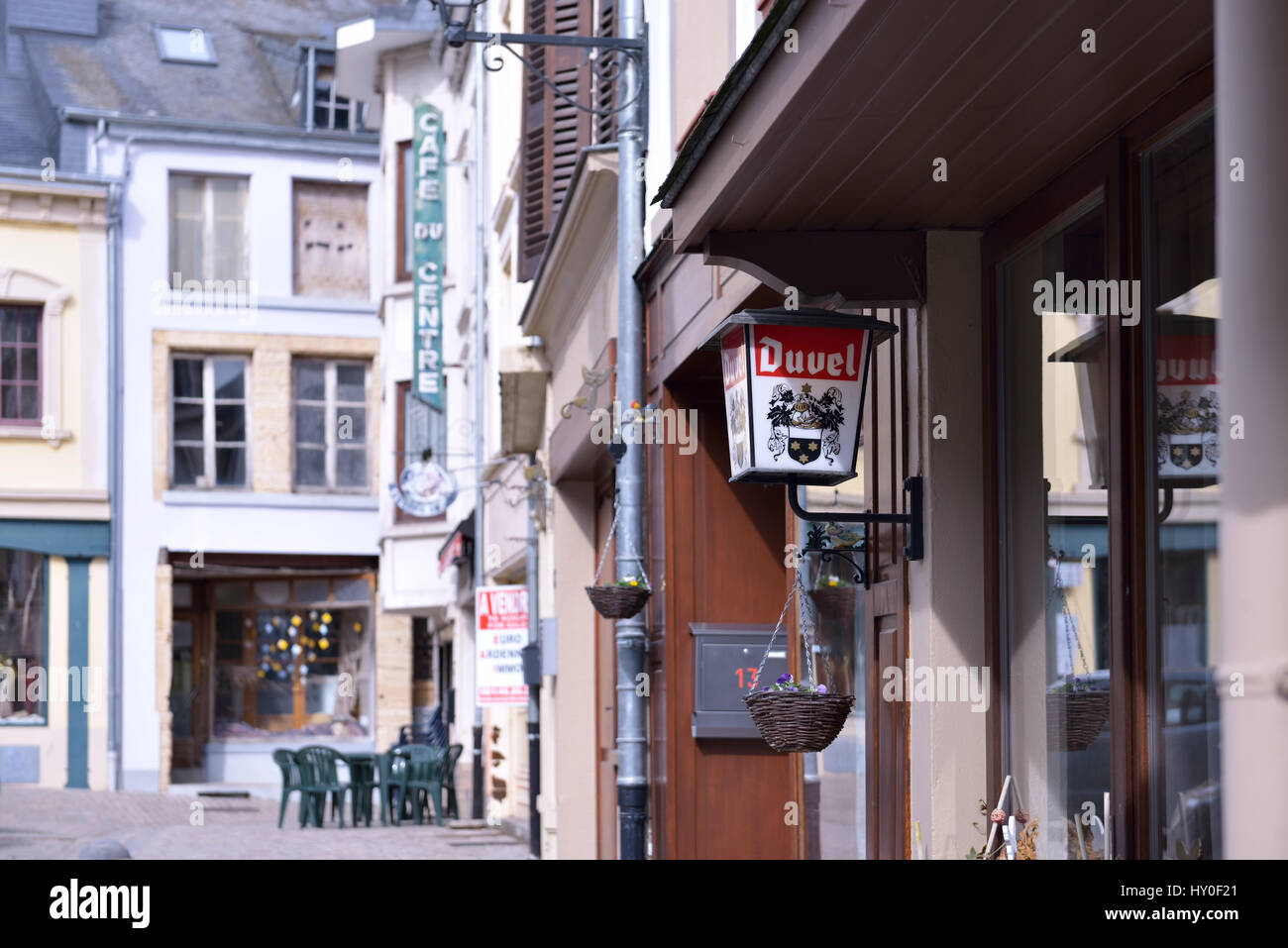 Narrow street with cafes and restaurants in center of Bouillon, on