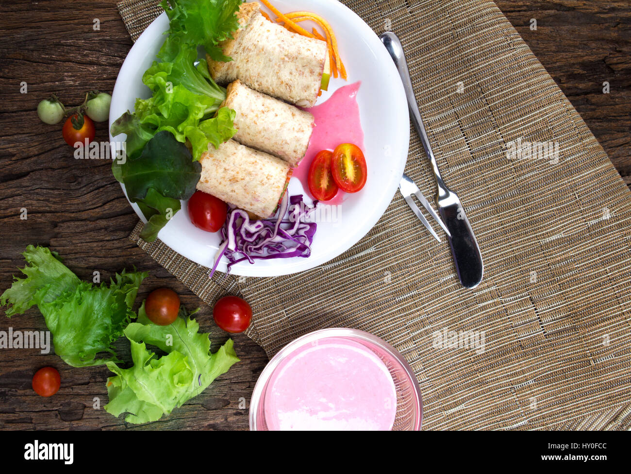 the fresh whole wheat bread wraps with vegetables and fruit on the