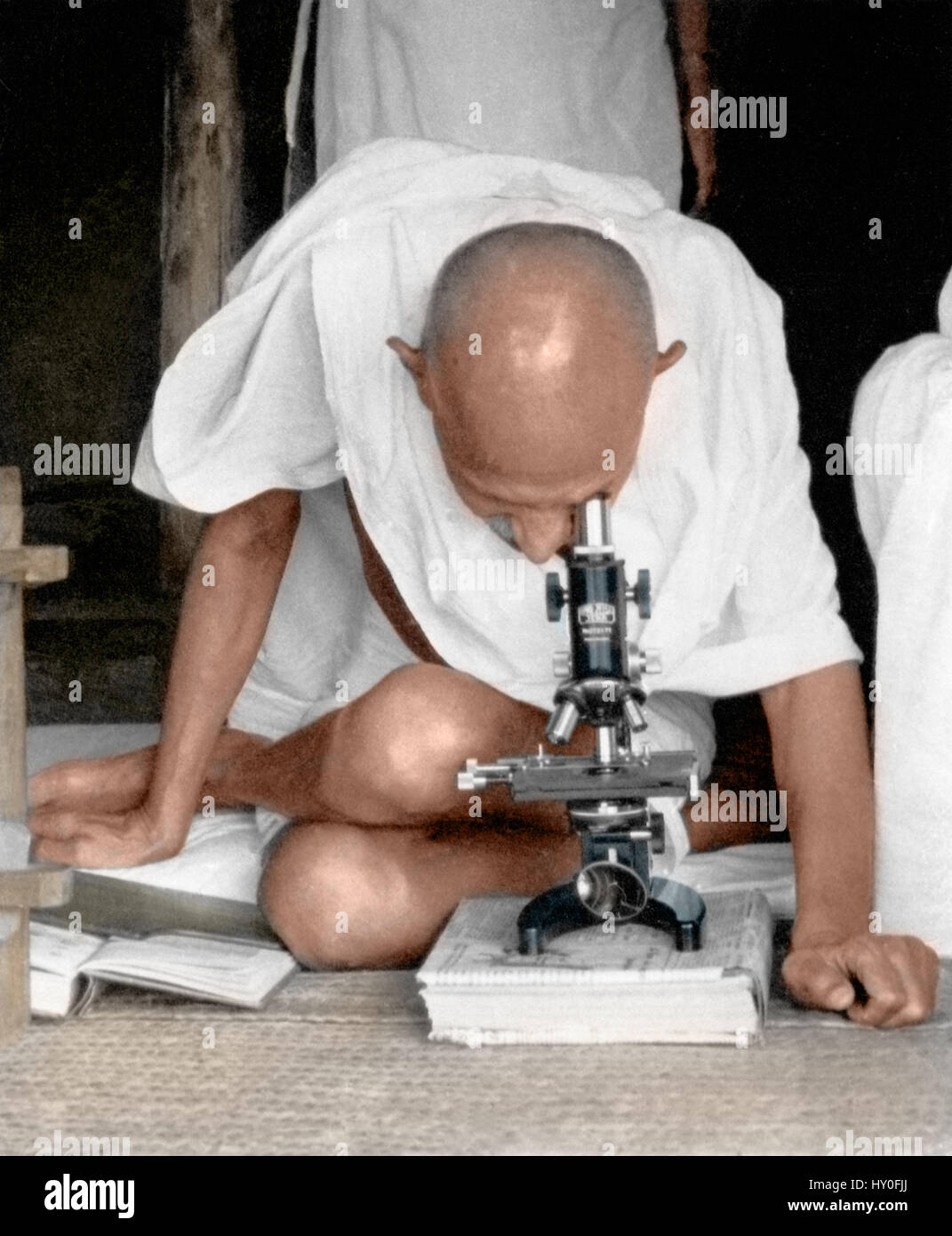 Mahatma gandhi observing leprosy germs, sevagram ashram, maharashtra, india, asia, 1940 Stock Photo