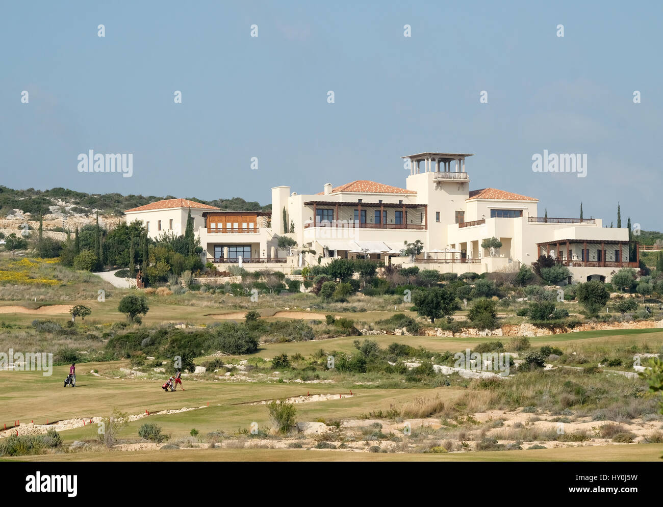 Golfers in the distance playing at the Elea Estates golf course in Paphos  Southern Cyprus Stock Photo - Alamy